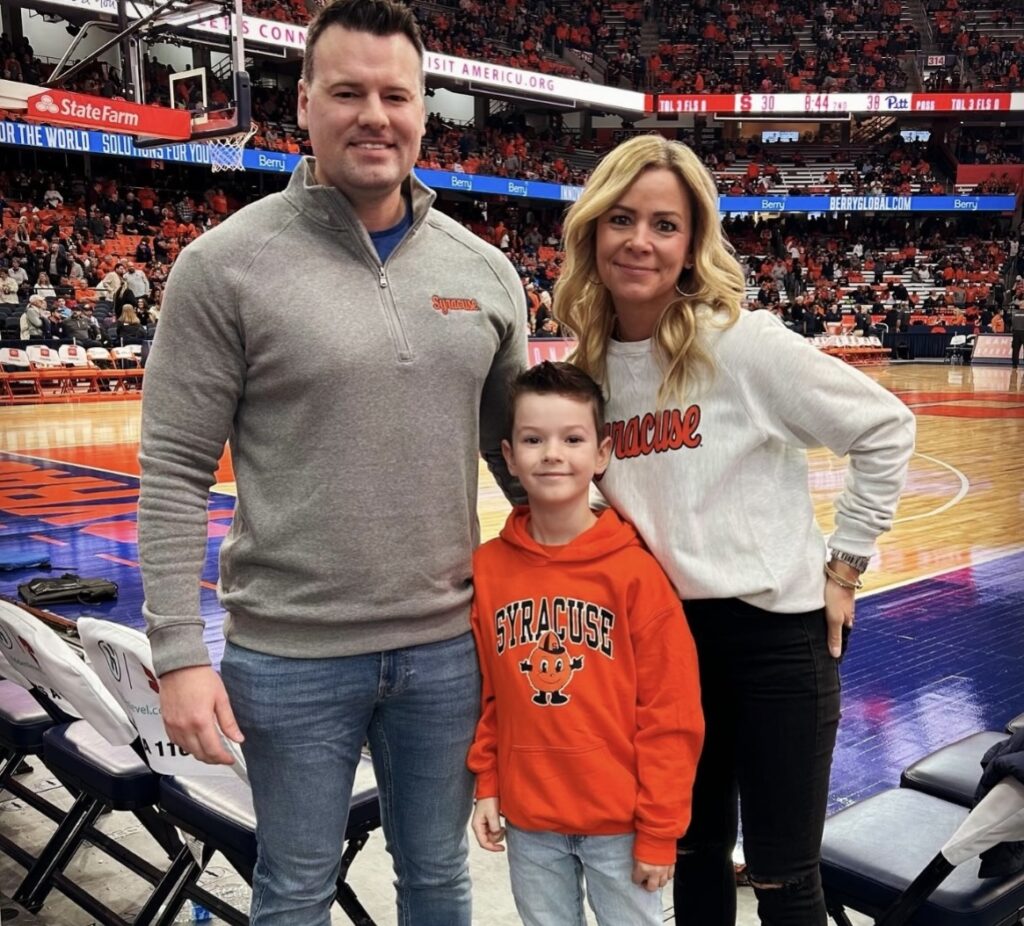 Angie Poirier and her family and a basketball game
